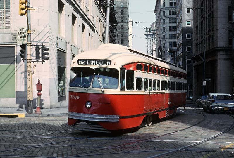 A Lincoln car on 6th Ave. crossing Grant St. in downtown Pittsburgh, PA on June 27, 1965