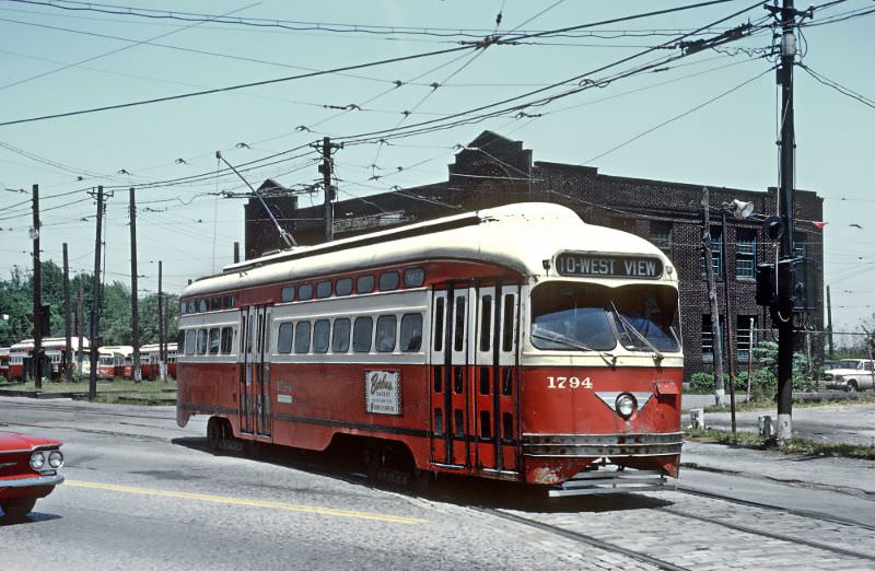 A West View departing Keating Car House and Crossing Perryville Ave. in Pittsburgh, PA on June 26, 1965