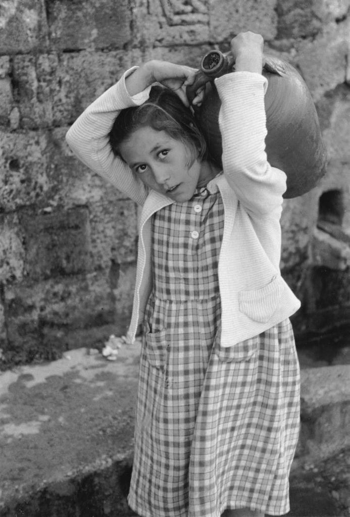 #27 Girl from the village of Lindos in Rhodes with a jug, 1954.