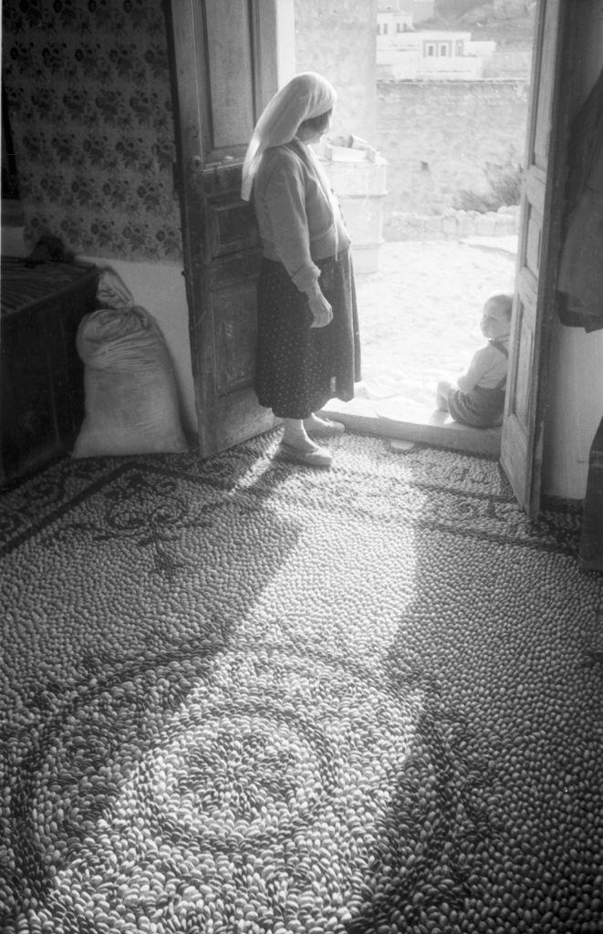 #34 A woman in the hallway of her home in Rhodes, Greece, 1950s.