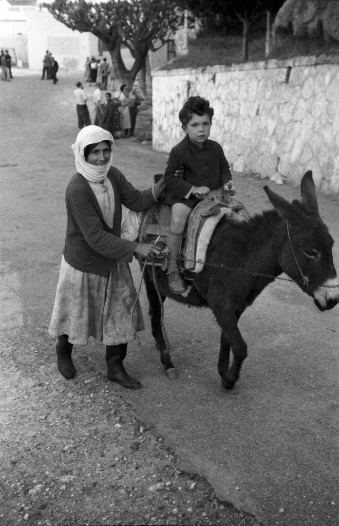 #41 Mother and son out and about with their donkey in Rhodes, Greece, 1950s.