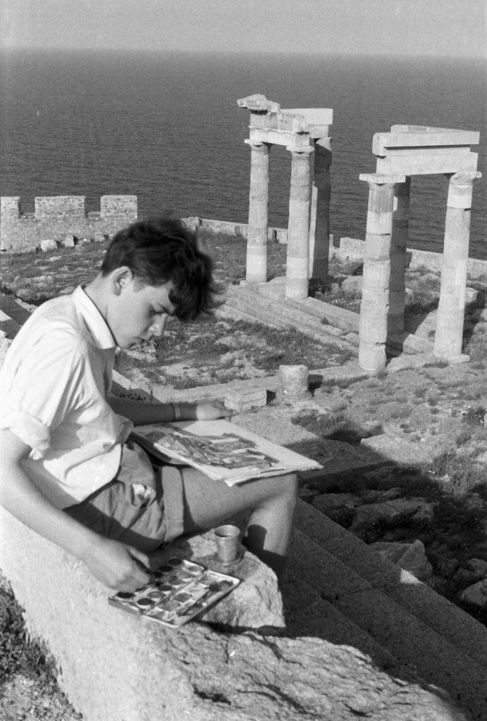 #47 A young man paints the temple ruins of Ialyssos on Rhodes in Greece, 1950s.