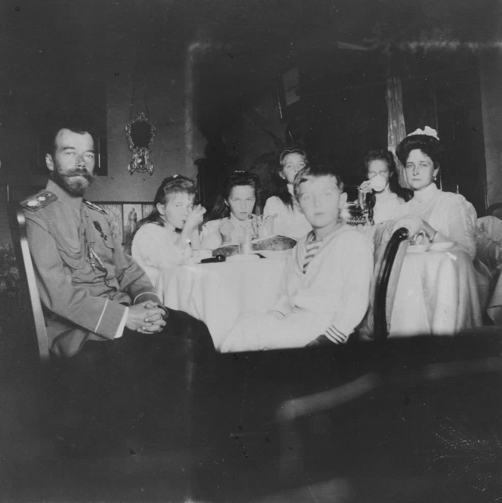 #3 Nicholas II and his wife, Empress Aleksandra (far right), with their four daughters and son.