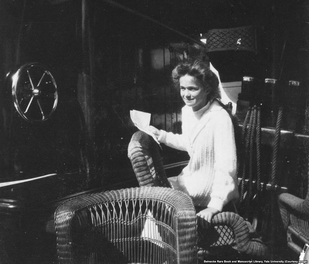#10 Olga Romanov in a wicker chair aboard the Standart.