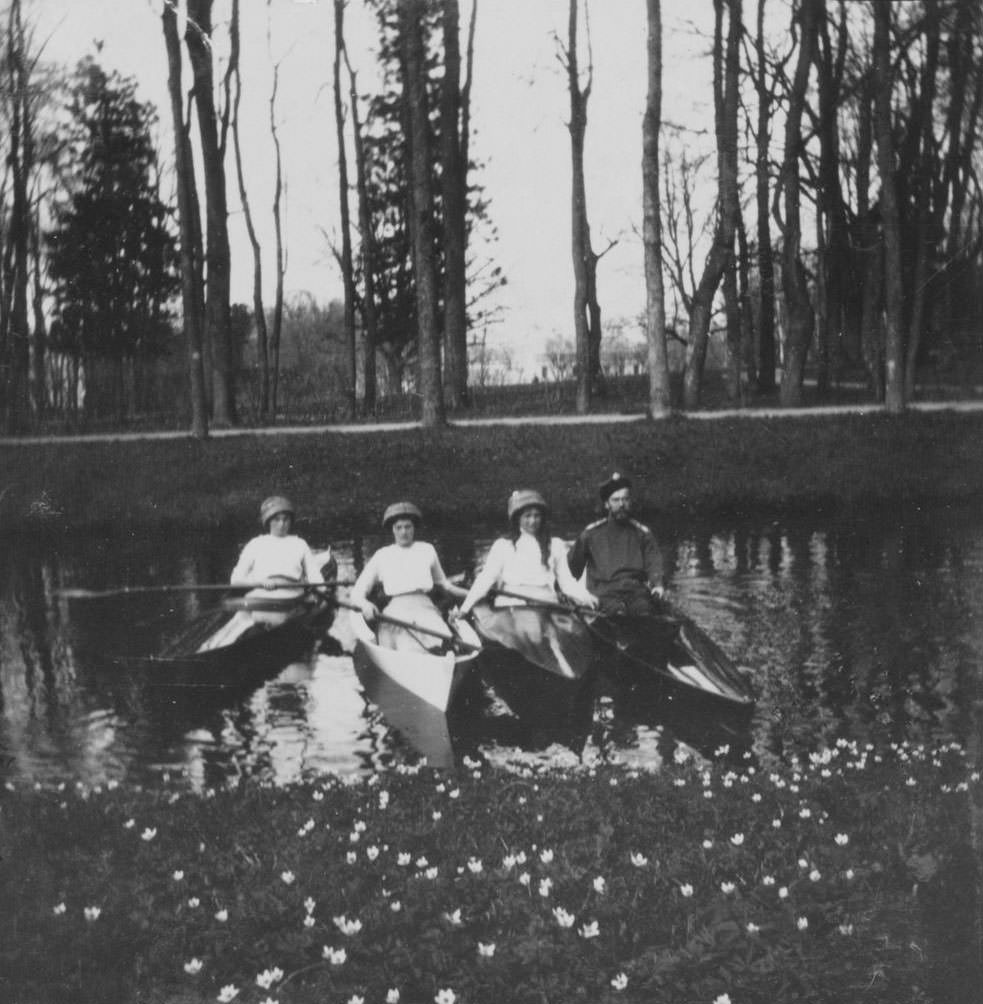 #11 Nicholas II and three of the grand duchesses floating in one of the canals of Tsarskoe Selo, near St. Petersburg.