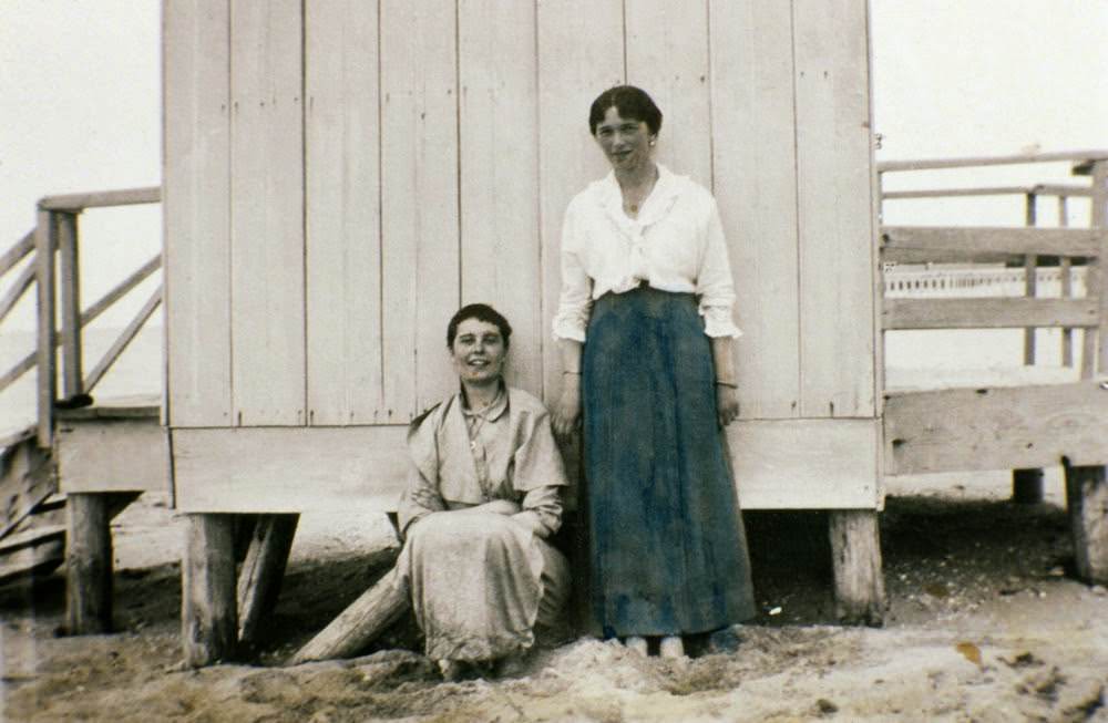 #33 An unidentified woman and Olga Romanov (at right)