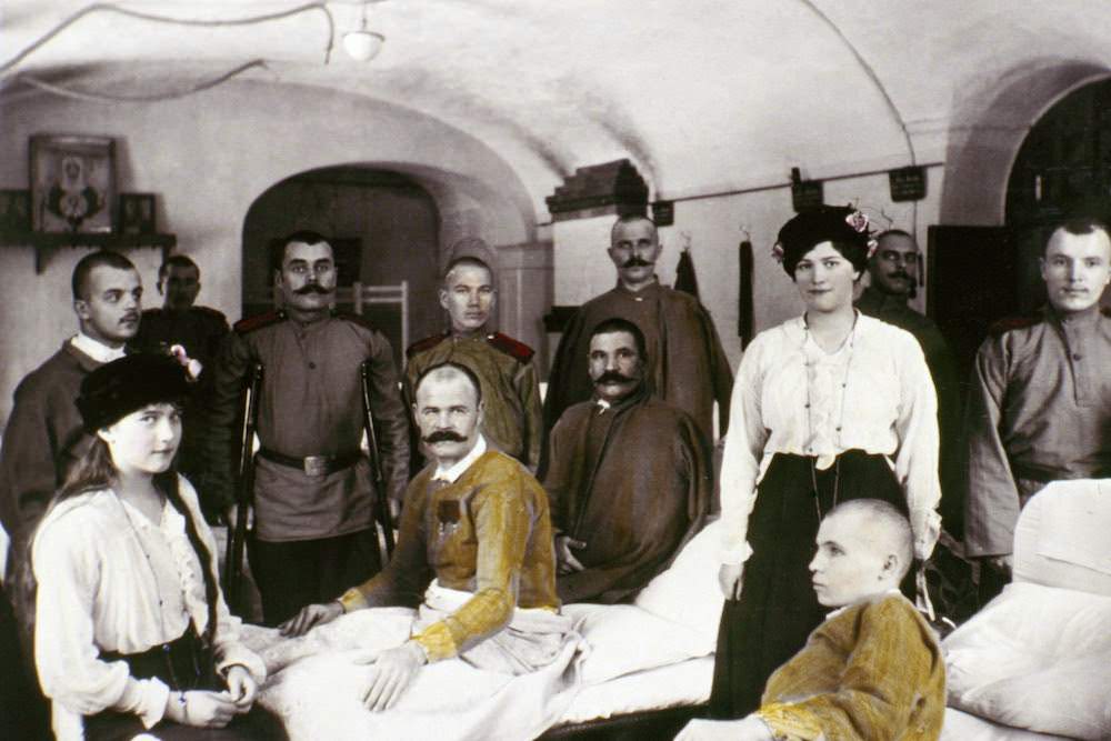 #12 Anastasia (at left) and Maria visit wounded WWI soldiers in hospital.