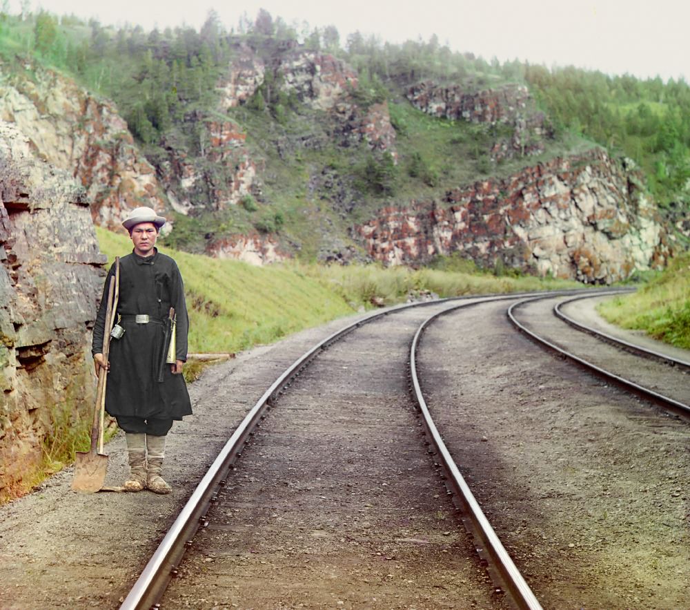 #18 A switch operator poses on the Trans-Siberian Railroad, near the town of Ust Katav on the Yuryuzan River in 1910.