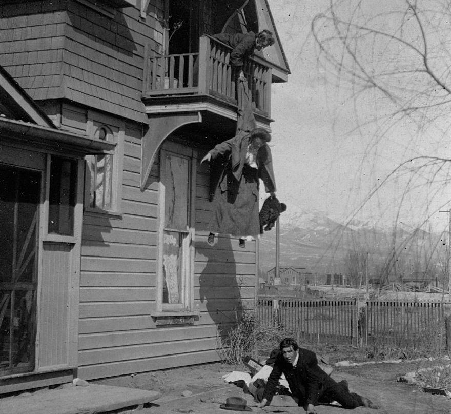 #42 A mother holding her daughter from a balcony, preventing her elopement with a man sprawled on the ground below, 1905.