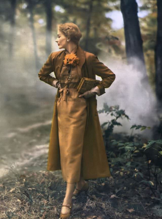 #37 Lisa Fonssagrives in two tones of copper shantung, lighter tone dress and darker tone duster coat from Vogue Couturier Pattern no.477, Vogue, January 1949
