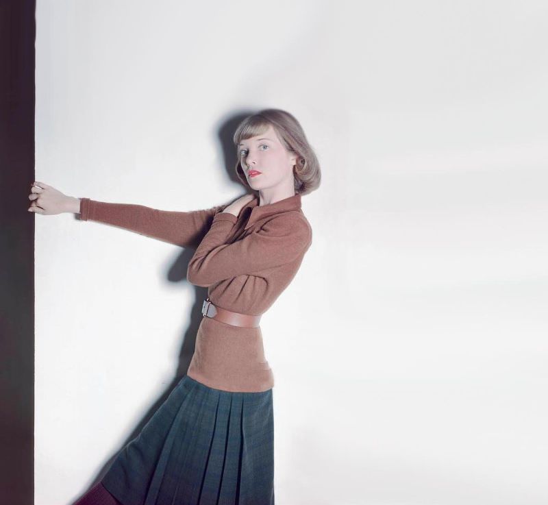 #8 Charlotte Payne in long brown jersey blouse, Farnsworth Black Watch plaid skirt, both by Tilly Schanzer, Glamour, 1946
