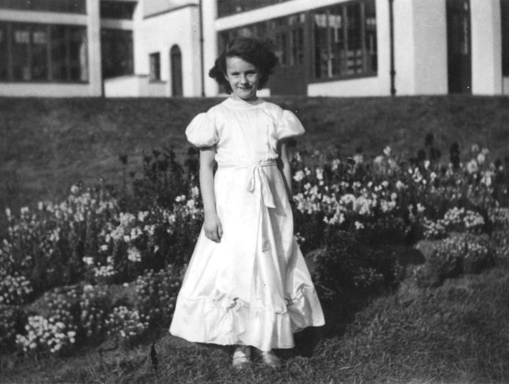 #12 A little girl dressed as a flower girl for a fancy dress party at Stannington Sanatorium, 1948.