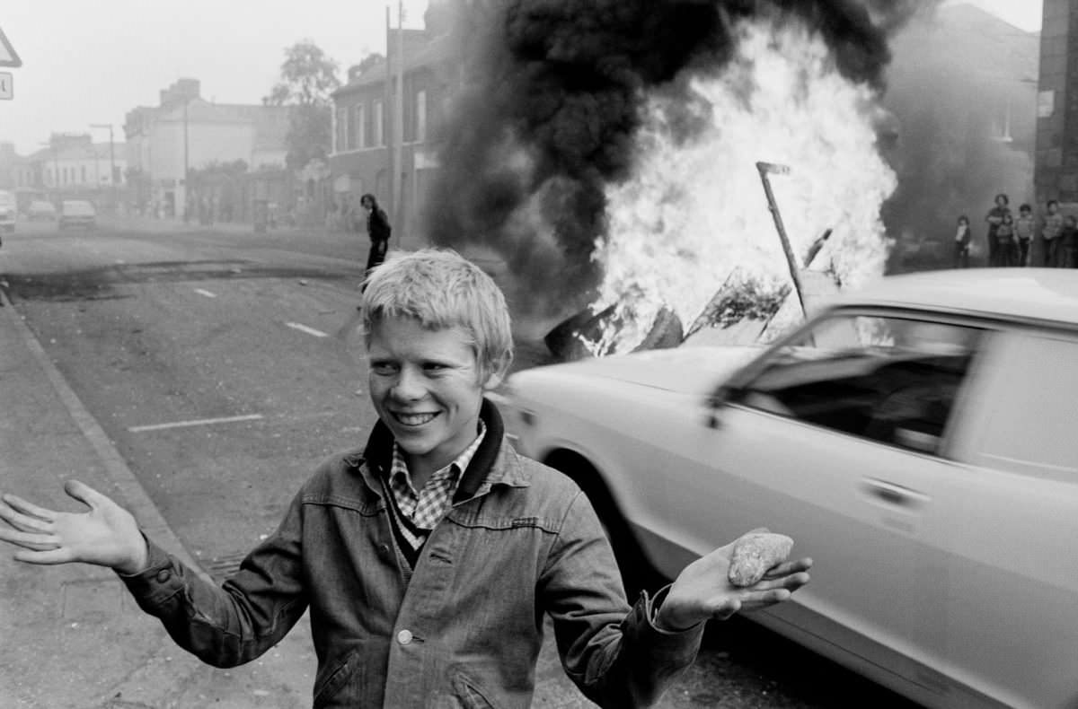#1 Youth with a stone during a riot at the top of Leeson Street, west Belfast, 1978