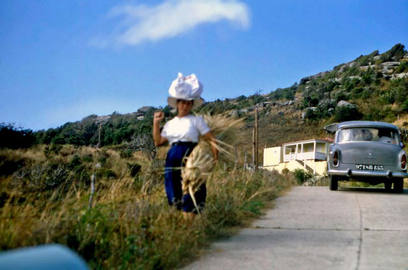 #40 Woman with rattan, St Barts, 1960s