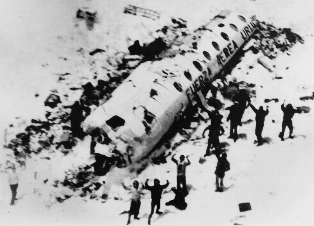 Survivors of Flight 571 outside of the plane’s wreckage.