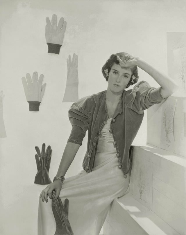 #24 Babe Paley wearing evening dress with shirred bodice, velvet jacket, and matching gloves by Talbot, 1937