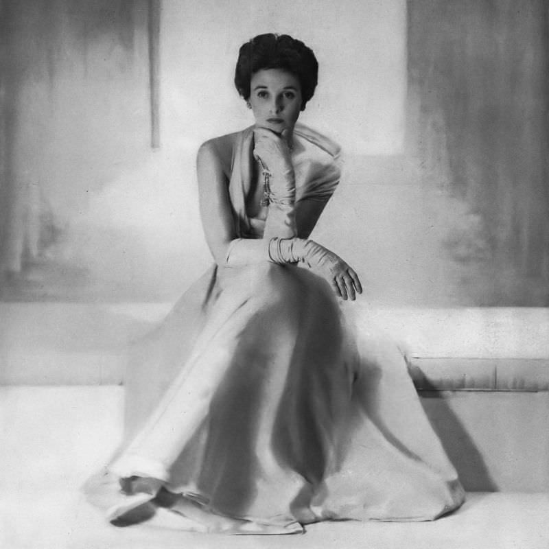 #11 Babe Paley in azure silk chiffon gown made to order at Hattie Carnegie, Vogue, February 1, 1949