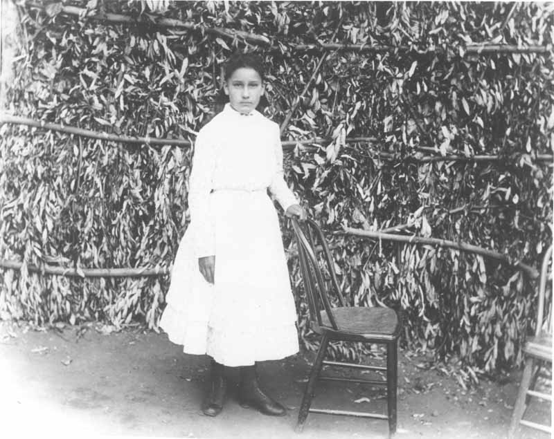 #21 A daughter of Jimmie Rosemyre posing. Photo taken on Ranch El Tejon, 1880s