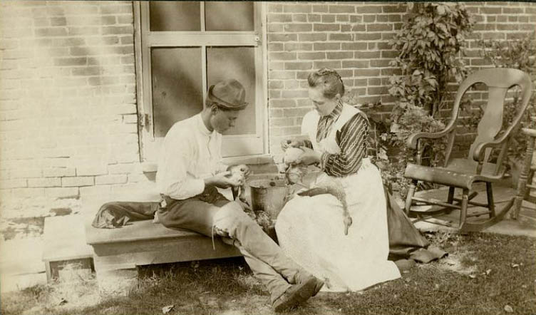 #14 Katherine Horack and her son, H. Claude Horack, sit on the back steps of their home, cleaning ducks that were presumably caught by H. Claude, 1895-1897