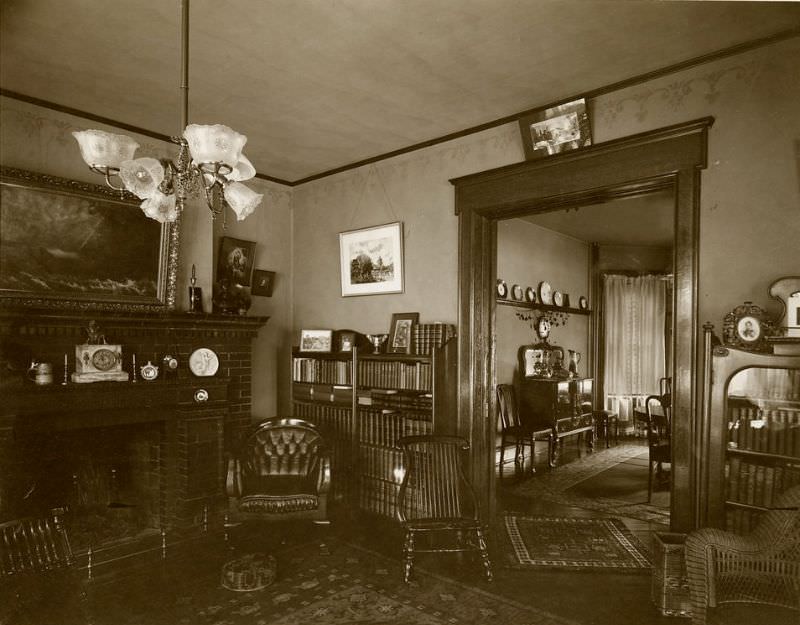 #22 Shambaugh house. A view of the library, with a view of the dining room beyond, 1904