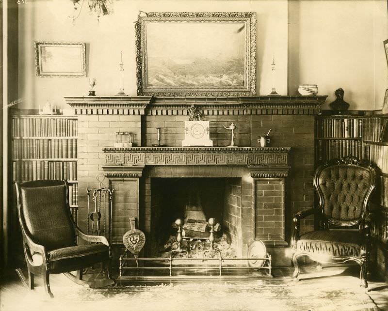 #24 A view of the library mantle with Greek key pattern and the fireplace.