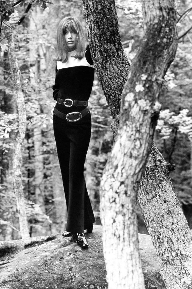 #22 Olga Georges-Picot wearing a sleeveless black wool knit jumpsuit with a white yoke, over a long-sleeve black shirt, 1969