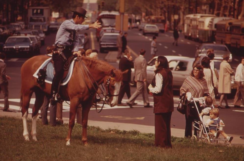 #26 Mounted Policeman On Busy Downtown Thoroughfare, August 1973