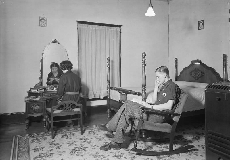 #32 Bedroom and living-room in company-owned home of workers in Highland Cotton Mills, High Point, North Carolina, 1936