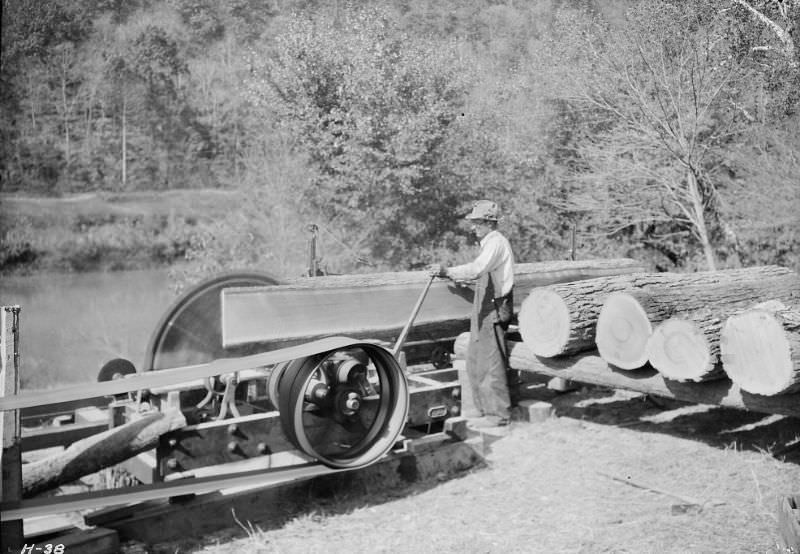 #12 Curtis Stiner operating a circular saw at the Norris Dam site, Tennessee, October 1933