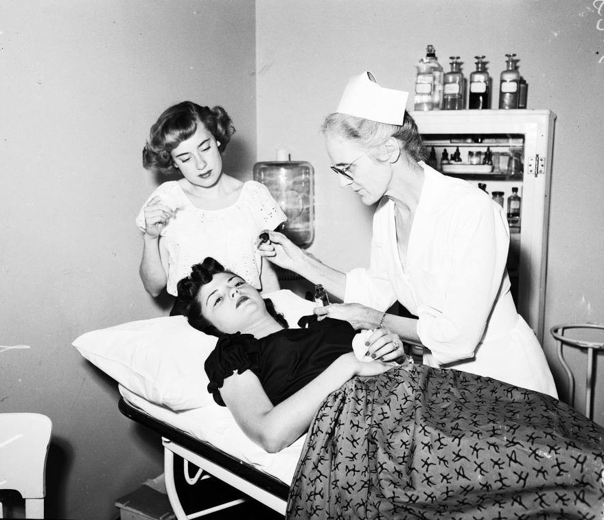 #126 Nancy Matthews at hospital for treatment. Her eyes were affected from smog, 1950