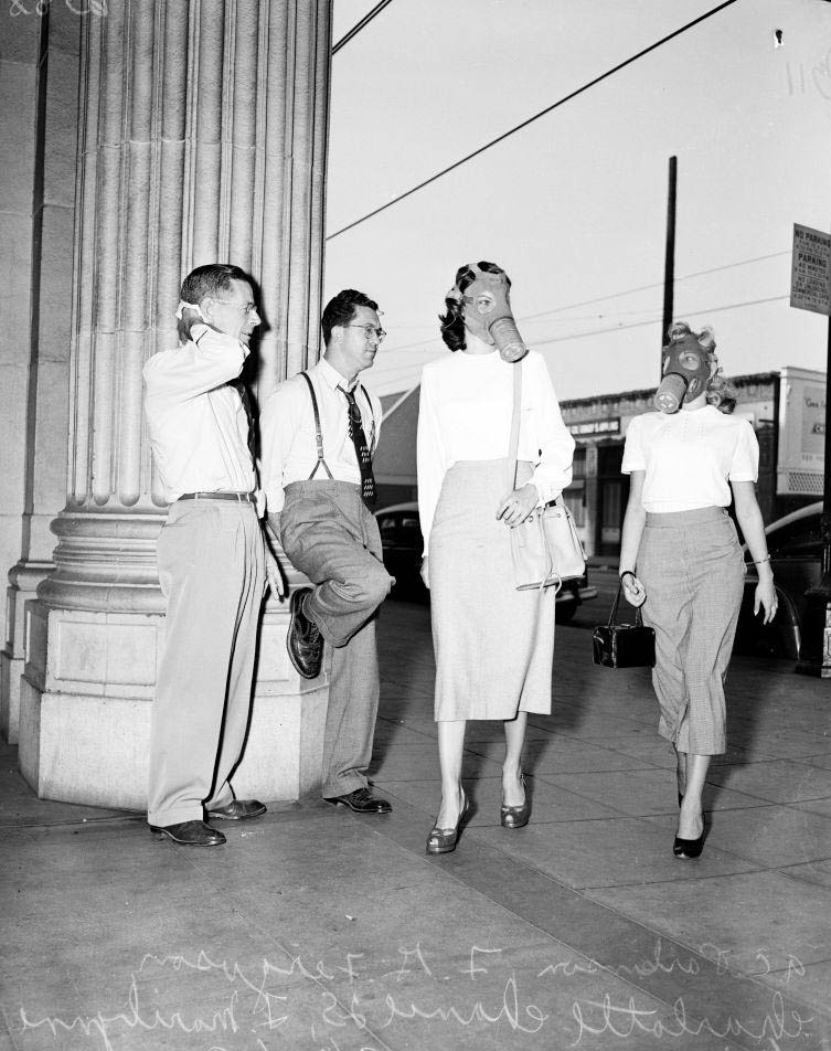 #37 Two women wearing mask for protection from smog, 1949