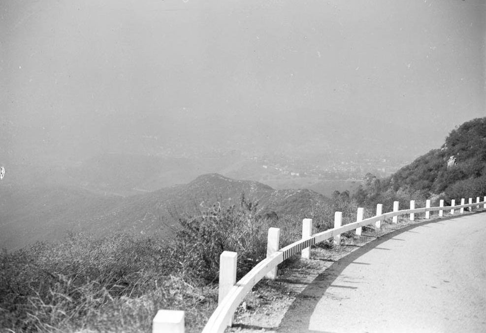 #73 Vine Street and Sunset Boulevard, north toward Hollywood Hills, showing dust, smudge and smog hanging over Hollywood, 1948