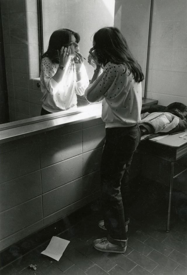 #37 Student applying makeup in mirror