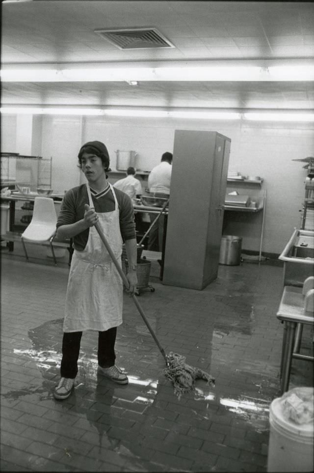 #40 Student mopping cafeteria kitchen