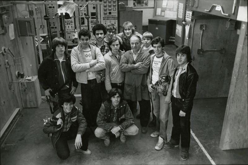 #43 Students and teacher posing in mechanical room