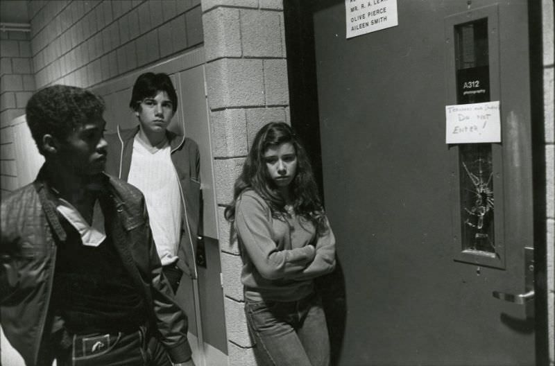 #59 Three students standing outside photography room