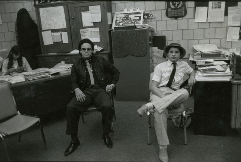 #67 Two students sitting in a school office
