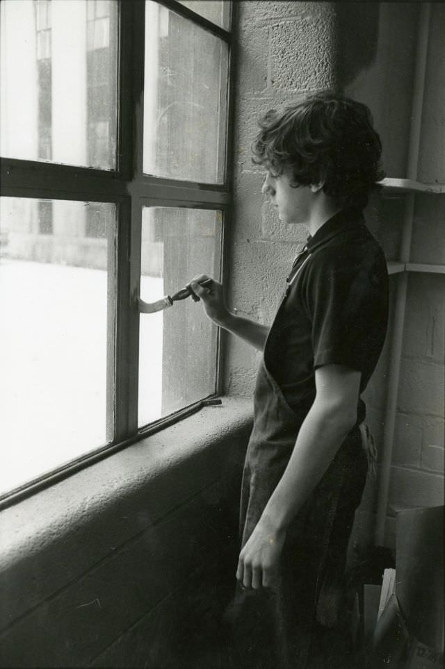#10 Boy painting a window frame