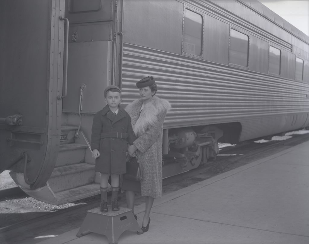 #40 Woman and Young Boy Standing next to a Santa Fe Train, Phoenix, 1940