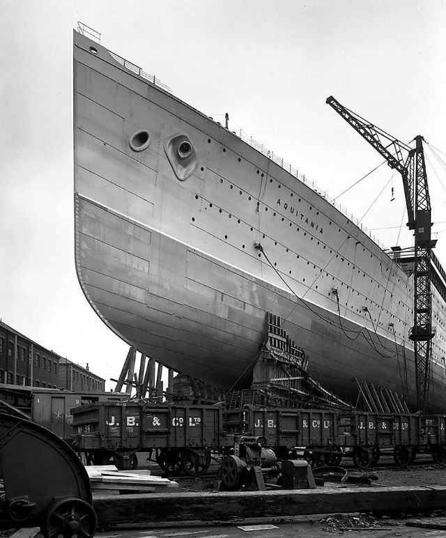 901 feet long, 97 feet wide. Passenger capacity- 610 1st Class, 950 2nd, and 1,998 3rd. The 45,647 ton Aquitania at John Brown &; Company shortly before her launch, circa 1913
