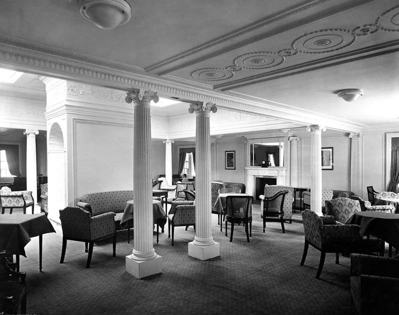 View of Aquitania’s 2nd Class Drawing Room, on the Bridge Deck (B Deck); a view from the starboard side, looking towards the fireplace at the forward end, May 1914