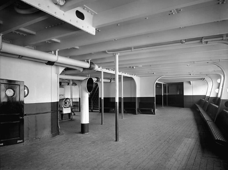Deck view showing Aquitania’s 3rd Class Promenade at the after end of the Upper Deck (D Deck), a view of the port side, looking aft. Sparred seats are fitted along the bulwark at the right edge of the image, May 1914