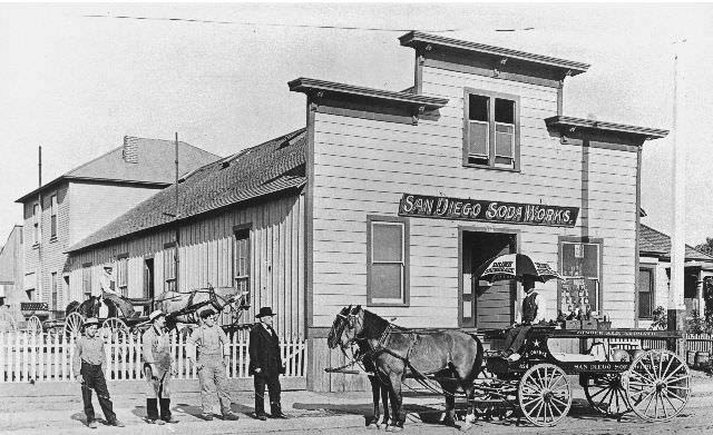 #12 Four men standing in front of a San Diego Soda Works delivery wagon at the San Diego Soda Works, 1898