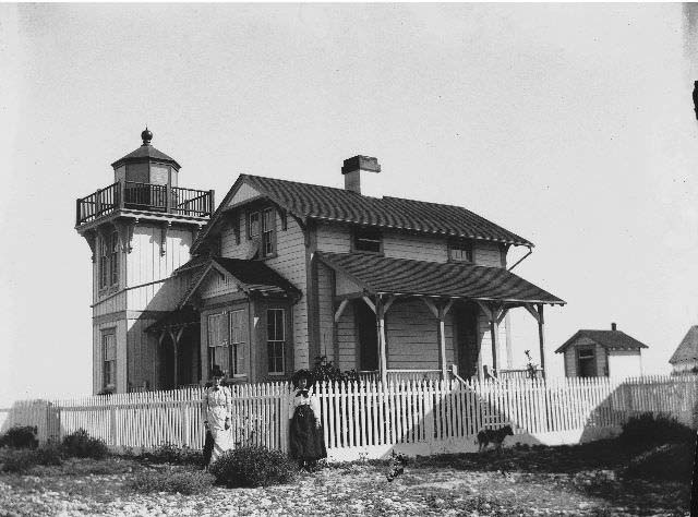 #61 Two women standing at the Ballast Point Lighthouse, 1899