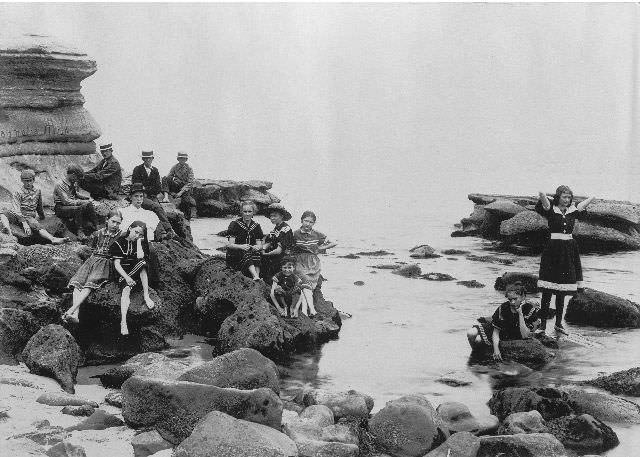 #15 Children and adults in bathing suits on the rocks at La Jolla beach, 1897