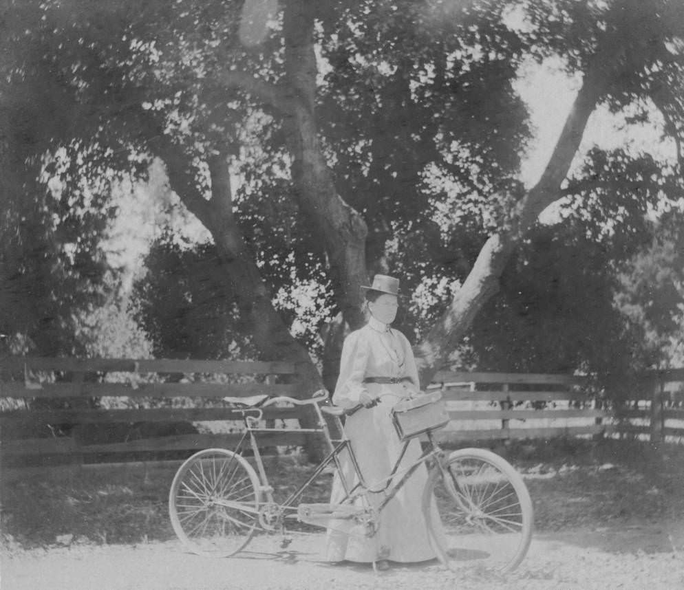#61 Woman with tandem bicycle, 1897.