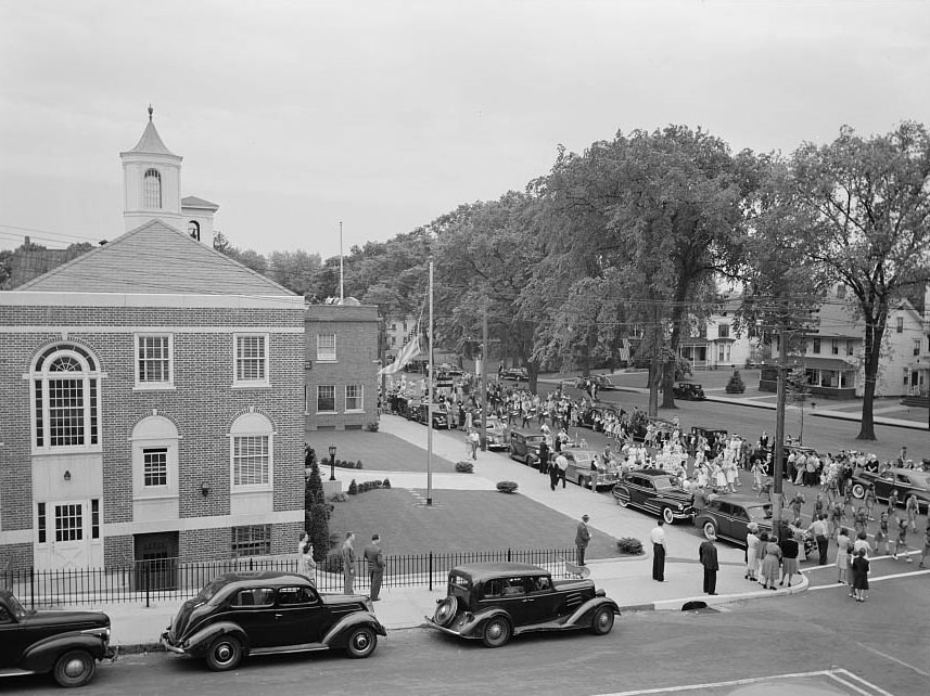 #61 The Memorial Day parade moving down the main street.