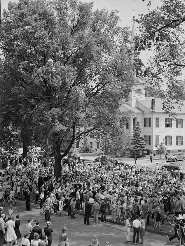 #59 The Memorial Day parade moving down the main street.