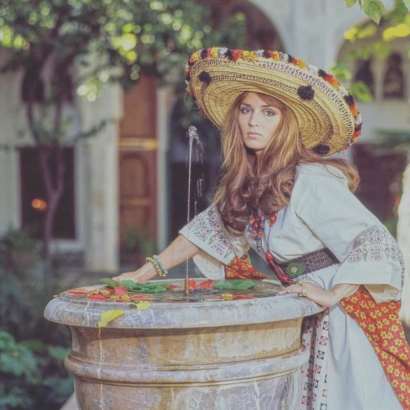 #10 Talitha Getty by a fountain in her garden in Marrkesh, Morocco, January 15, 1970