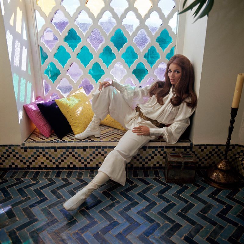 #20 Talitha Getty sitting by a window in her house in Marrakesh, Morocco, January 15, 1970